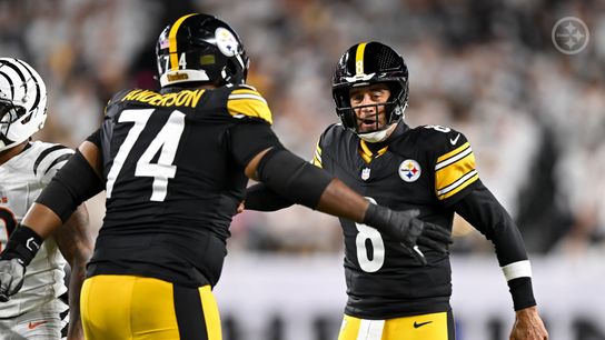 Steelers' Aaron Rodgers (8) celebrates with offensive lineman Spencer Anderson (74) during a Thursday Night Football game against the Cincinnati Bengals in 2025.