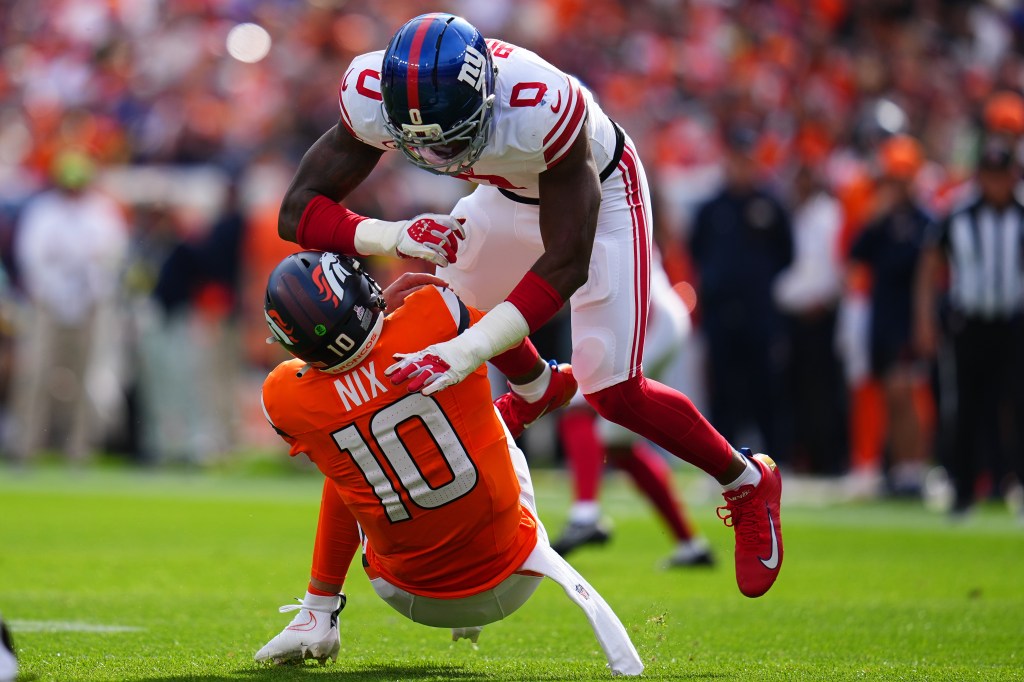 Brian Burns (0) of the Giants sacks Broncos quarterback Bo Nix (10) on Oct. 19, 2025.