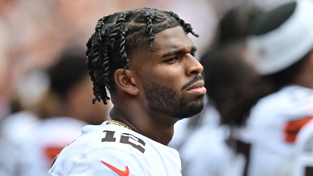 Cleveland Browns quarterback Shedeur Sanders (12) listens to the national anthem before the game between the Browns and the Los Angeles Rams at Huntington Bank Field. Mandatory Credit: