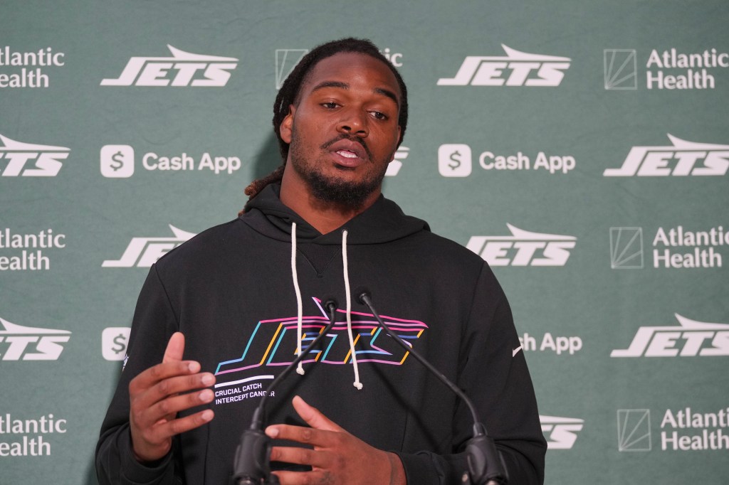 New York Jets linebacker Jamien Sherwood (44) speaking at a press conference.