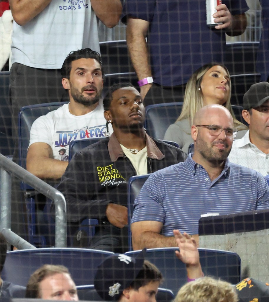 ALDS Game 3 - Toronto Blue Jays vs. New York Yankees at Yankee Stadium - New York Giants Malik Nabers sits behind home plate during tonightss game.
