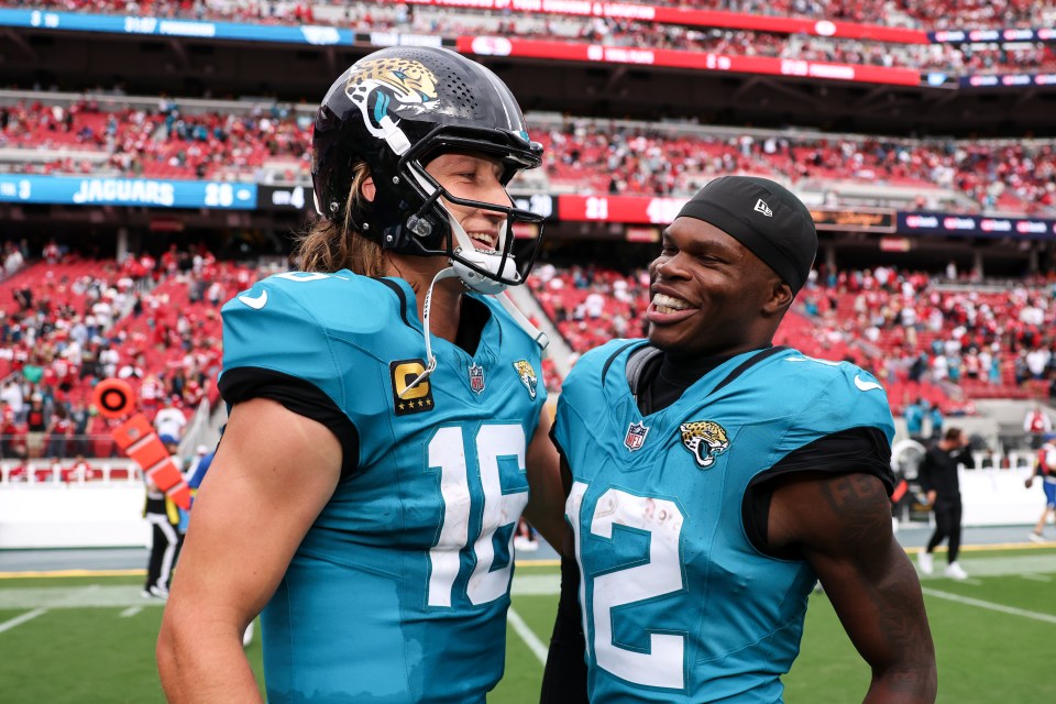 A picture of Travis Hunter chest bumping Trevor Lawrence