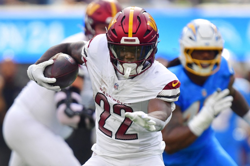 Commanders running back Jacory Croskey-Merritt runs against the Chargers at SoFi Stadium.
