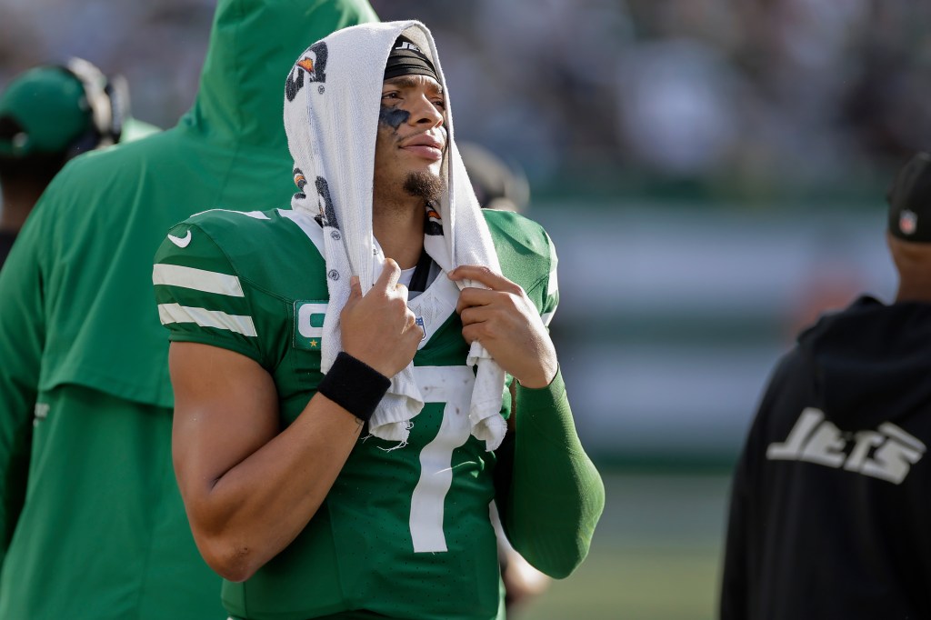 Jets quarterback Justin Fields (7) watches from the sidelines during the fourth quarter of an NFL football game against the Carolina Panthers, Sunday, Oct. 19, 2025, in East Rutherford, N.J. 