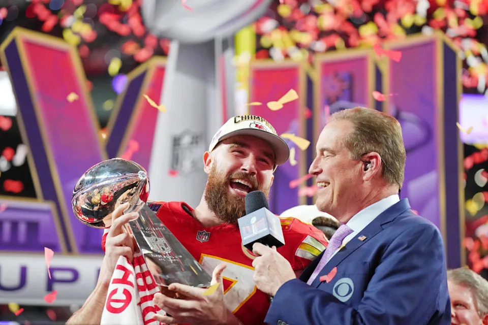 Kansas City Chiefs tight end Travis Kelce (87) celebrates while being interviewed by CBS commentator Jim Nantz after winning Super Bowl LVIII against the San Francisco 49ers at Allegiant Stadium.© Kirby Lee-USA TODAY Sports