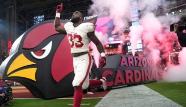Arizona Cardinals running back Trey Benson (33) runs out on to the field before they play the Seattle Seahawks at State Farm Stadium in Glendale on Sept. 25, 2025.
