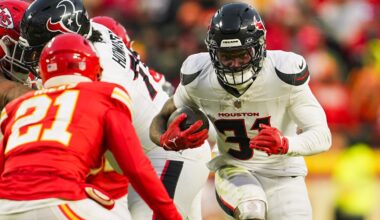 Jan 18, 2025; Kansas City, Missouri, USA; Former Houston Texans running back Dameon Pierce (31) runs the ball against Kansas City Chiefs safety Jaden Hicks (21) during the second half in a 2025 AFC divisional round game at GEHA Field at Arrowhead Stadium.