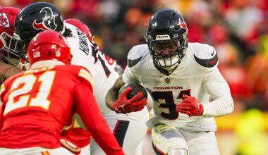 Jan 18, 2025; Kansas City, Missouri, USA; Houston Texans running back Dameon Pierce (31) runs the ball against Kansas City Chiefs safety Jaden Hicks (21) during the second half in a 2025 AFC divisional round game at GEHA Field at Arrowhead Stadium. Mandatory Credit: Jay Biggerstaff-Imagn Images