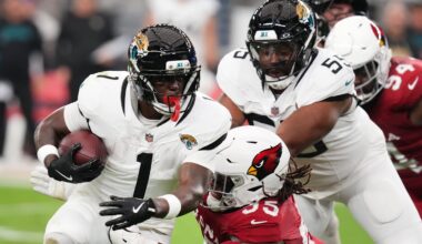 Arizona Cardinals defensive lineman Dante Stills (55) tackles Jacksonville Jaguars running back Travis Etienne Jr. (1) at State Farm Stadium on Nov. 23, 2025.
