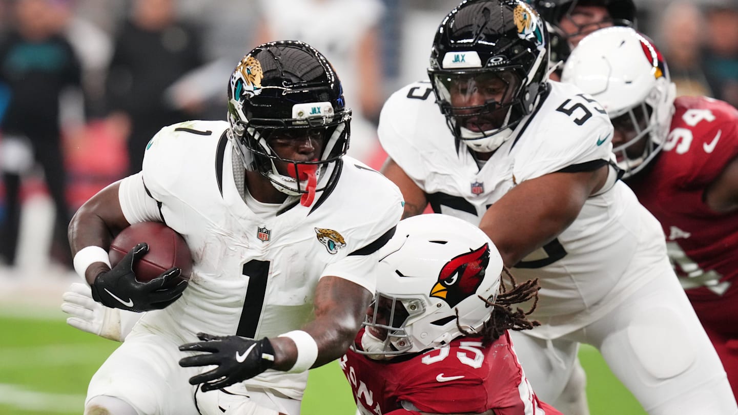Arizona Cardinals defensive lineman Dante Stills (55) tackles Jacksonville Jaguars running back Travis Etienne Jr. (1) at State Farm Stadium on Nov. 23, 2025.