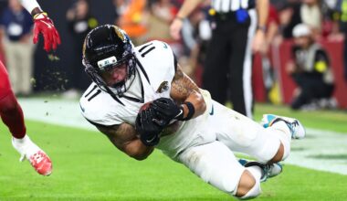 Nov 23, 2025; Glendale, Arizona, USA; Jacksonville Jaguars wide receiver Parker Washington (11) scores a touchdown as Arizona Cardinals cornerback Garrett Williams (21) defends during the fourth quarter at State Farm Stadium. Mandatory Credit: Mark J. Rebilas-Imagn Images