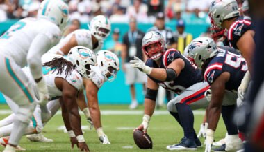 Sep 14, 2025; Miami Gardens, Florida, USA; New England Patriots center Garrett Bradbury (65) lines up against the Miami Dolphins in the fourth quarter at Hard Rock Stadium. Mandatory Credit: Nathan Ray Seebeck-Imagn Images