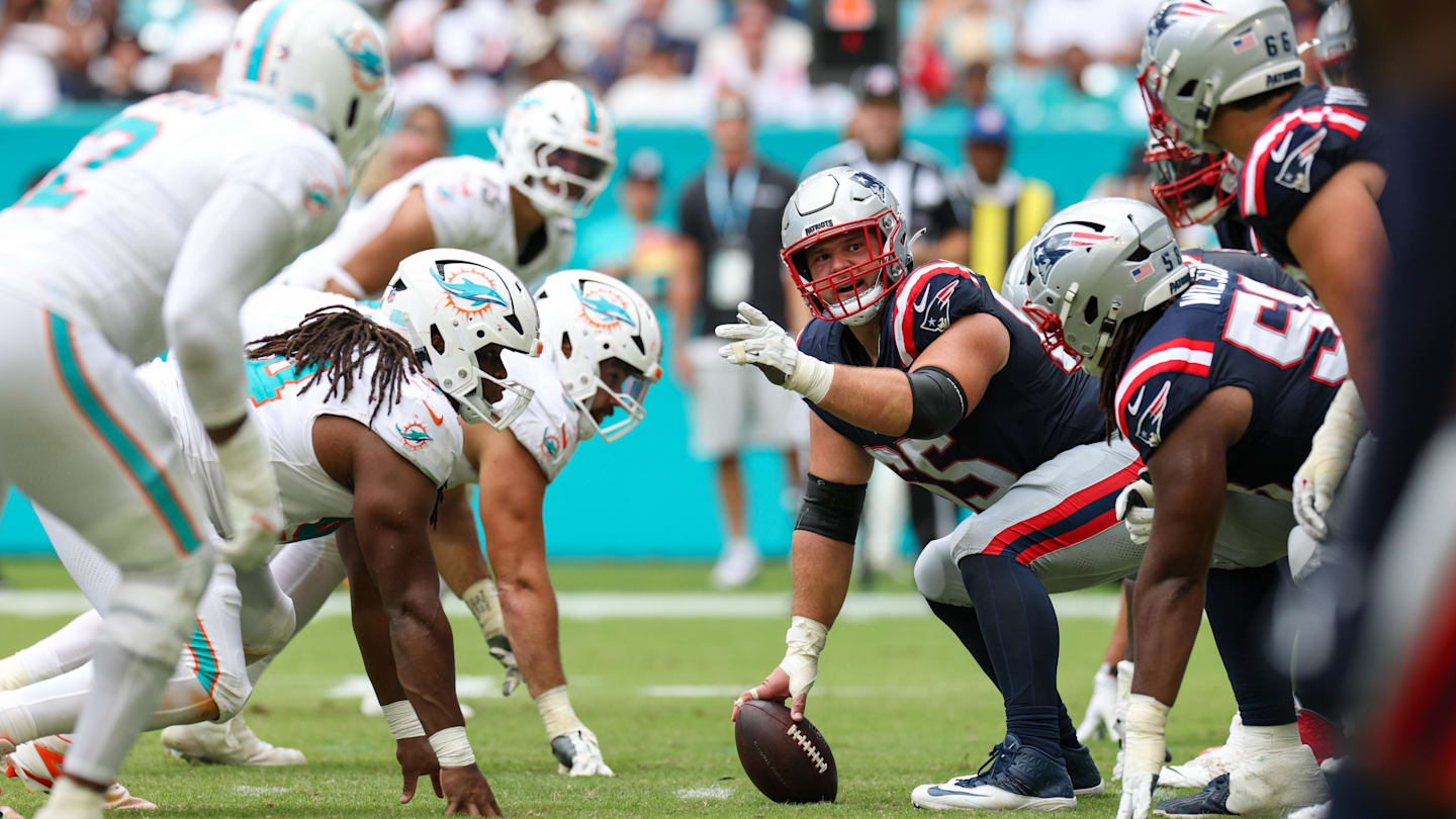 Sep 14, 2025; Miami Gardens, Florida, USA; New England Patriots center Garrett Bradbury (65) lines up against the Miami Dolphins in the fourth quarter at Hard Rock Stadium. Mandatory Credit: Nathan Ray Seebeck-Imagn Images
