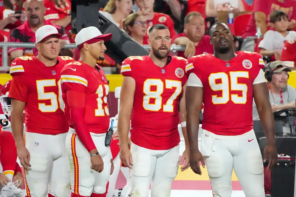 Kansas City Chiefs quarterback Patrick Mahomes (second from left), tight end Travis Kelce (87) and defensive tackle Chris Jones (95) on the sideline.Denny Medley-Imagn Images