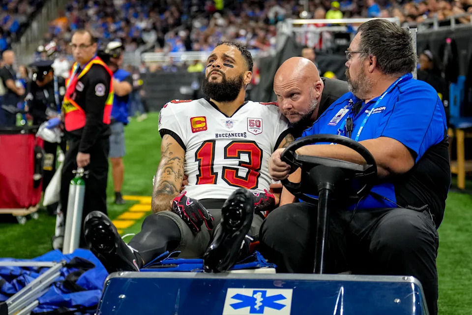 DETROIT, MICHIGAN - OCTOBER 20: Mike Evans #13 of the Tampa Bay Buccaneers is helped off the field after an injury during the first half of the game against the Detroit Lions at Ford Field on October 20, 2025 in Detroit, Michigan. (Photo by Nic Antaya/Getty Images)