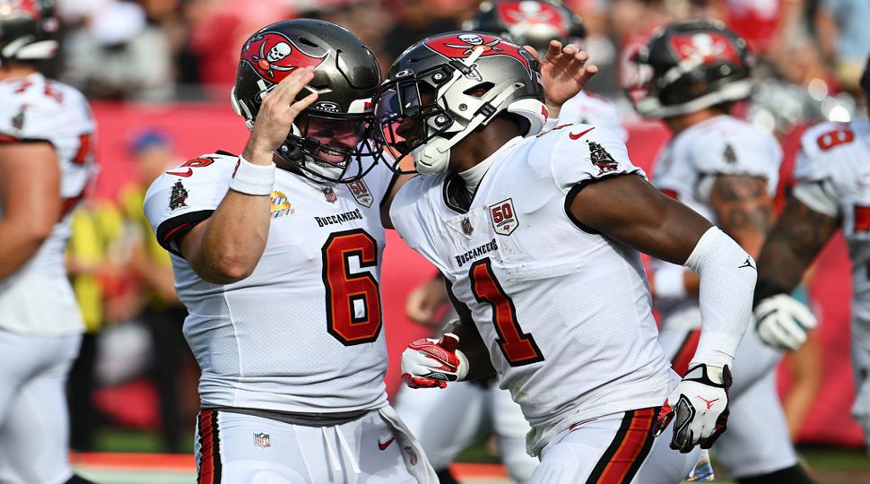 Tampa Bay Buccaneers running back Rachaad White, right, quarterback Baker Mayfield (6) and the Buccaneers will host the New England Patriots on Sunday. (AP Photo/Jason Behnken)
