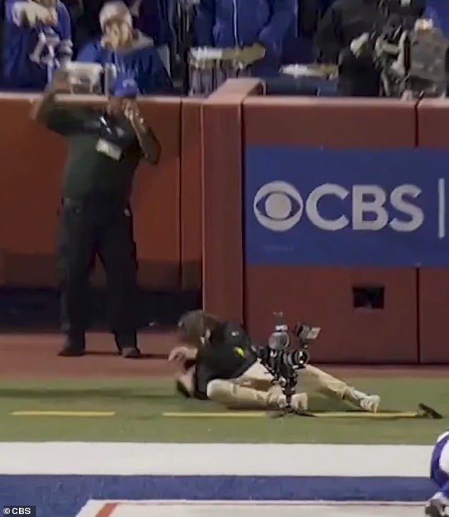 Although the cameraman hasn't been identified, the NFL did announce 'he's okay'