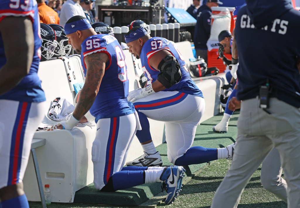 Roy Robertson-Harris #95 and Dexter Lawrence II #97 of the New York Giants on the bench during the second quarter.