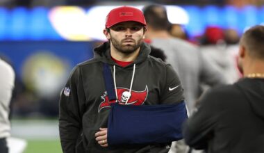 Tampa Bay Buccaneers quarterback Baker Mayfield (6) looks on from the sidelines wearing a sling during the second half against the Los Angeles Rams in an NFL football game Sunday, Nov. 23, 2025, in Inglewood, Calif. (AP Photo/Jessie Alcheh)