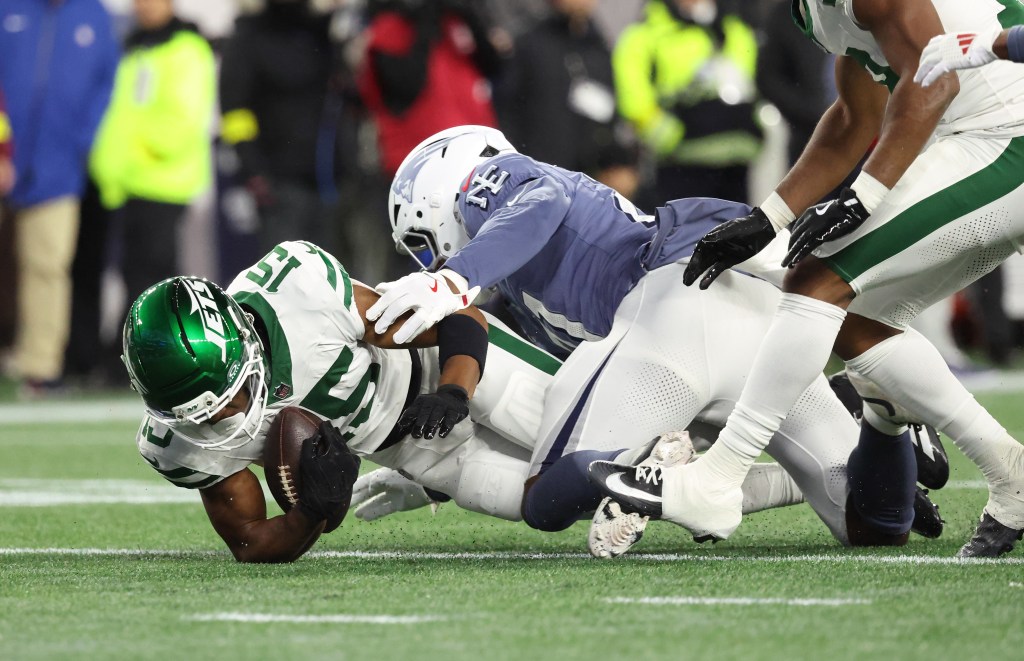Adonai Mitchell #15 of the New York Jets catches a first down pass during the first quarter.