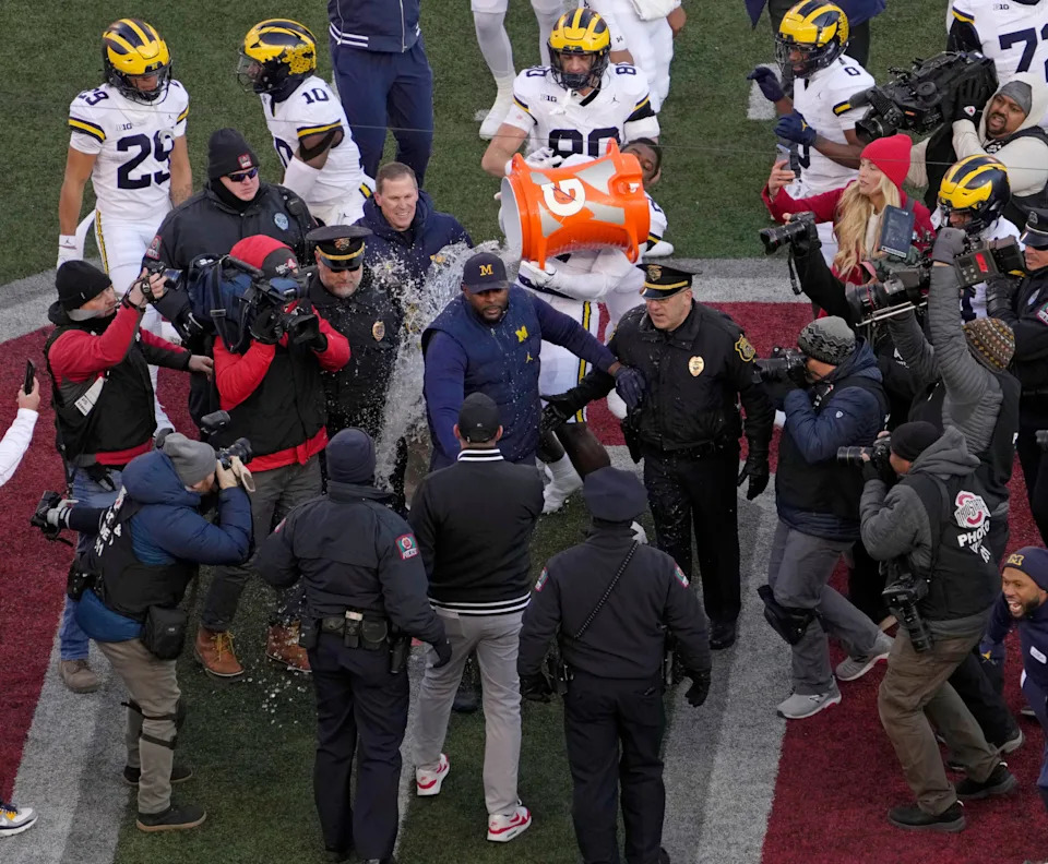 Ohio State Buckeyes head coach Ryan Day and Michigan Wolverines head coach Sherrone Moore shake hands at midfield following Saturday’s NCAA Division I football game at Ohio Stadium.