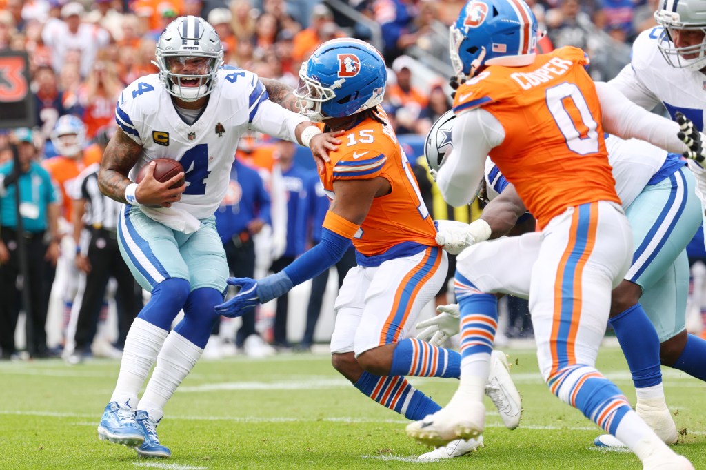 Dak Prescott (4) gets sacked by the Broncos' Nik Bonitto (15) on Oct. 26, 2025.