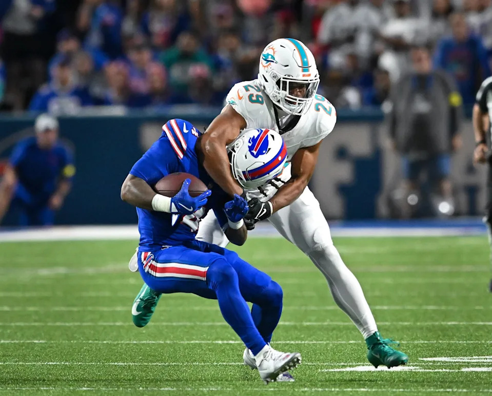 Miami Dolphins free safety Minkah Fitzpatrick tackles Buffalo Bills running back James Cook in the first quarter at Highmark Stadium, Sept. 18, 2025 in Orchard Park, New York.