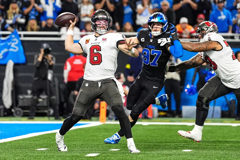 Tampa Bay Buccaneers quarterback Baker Mayfield (6) makes a pass against Detroit Lions defensive end Aidan Hutchinson (97) during the second half at Ford Field in Detroit on Monday, Oct. 20, 2025.
