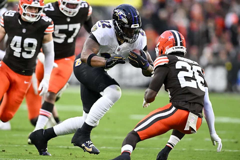 CLEVELAND, OHIO - NOVEMBER 16: Derrick Henry #22 of the Baltimore Ravens carries the ball defended by Myles Harden #26 of the Cleveland Browns during the first quarter at Huntington Bank Field on November 16, 2025 in Cleveland, Ohio. (Photo by Nick Cammett/Getty Images)
