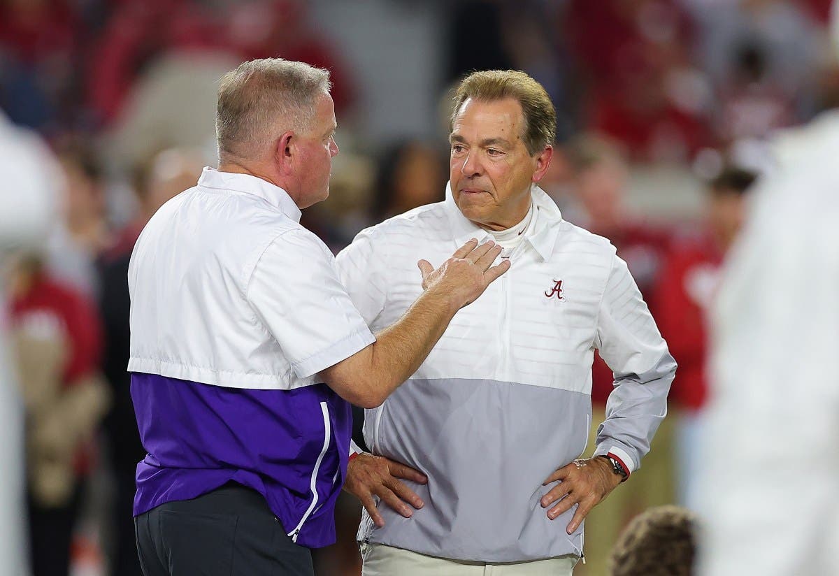 Former college football head coach Nick Saban of the Alabama Crimson Tide and head coach Brian Kelly of the LSU Tigers