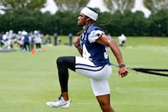 Dallas Cowboys cornerback Shavon Revel Jr. works with a resistance band during practice at...