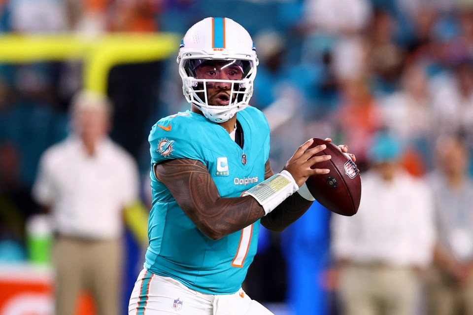 Tua Tagovailoa #1 of the Miami Dolphins looks to throw a pass against the Baltimore Ravens