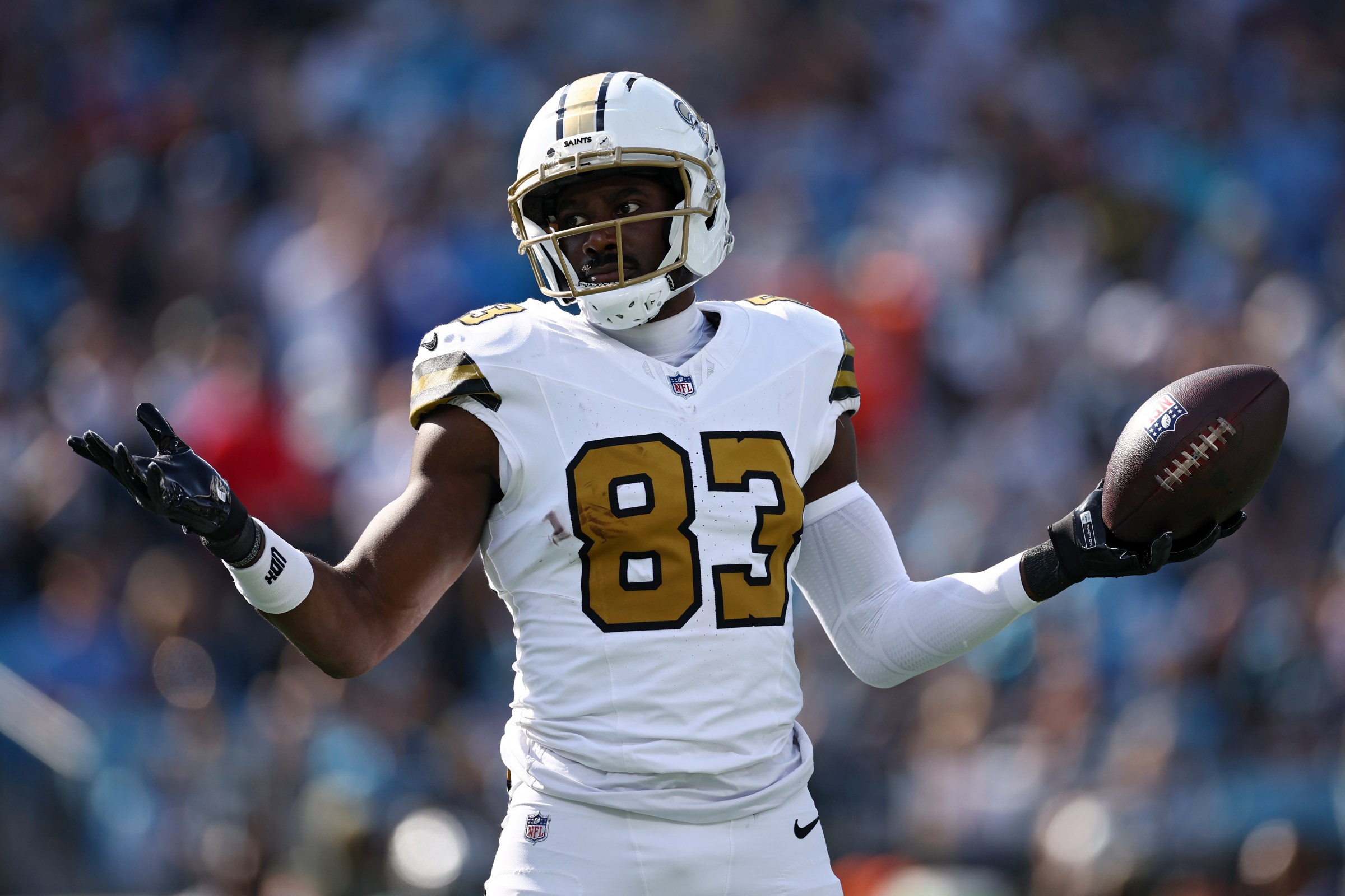 CHARLOTTE, NORTH CAROLINA - NOVEMBER 09: Juwan Johnson #83 of the New Orleans Saints reacts after a reception against the Carolina Panthers during the first half in the game at Bank of America Stadium on November 09, 2025 in Charlotte, North Carolina. (Photo by Jared C. Tilton/Getty Images)