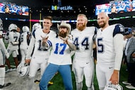 Rapper, singer and songwriter Post Malone (center) poses for a photo with place kicker...