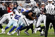 Dallas Cowboys defensive tackle Quinnen Williams (92) sacks Las Vegas Raiders quarterback...