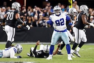 Dallas Cowboys defensive tackle Quinnen Williams (92) celebrates a sack during the first...