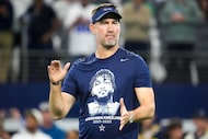 Dallas Cowboys head coach Brian Schottenheimer wears a t-shirt honoring late Cowboys...