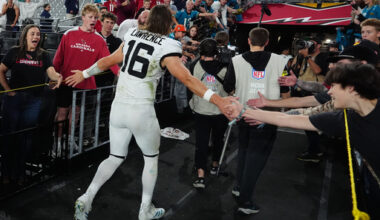 Jacksonville Jaguars quarterback Trevor Lawrence greets fans as he leaves the field after an NFL football game against the Arizona Cardinals Sunday, Nov. 23, 2025, in Glendale, Ariz. (AP Photo/Ross D. Franklin)