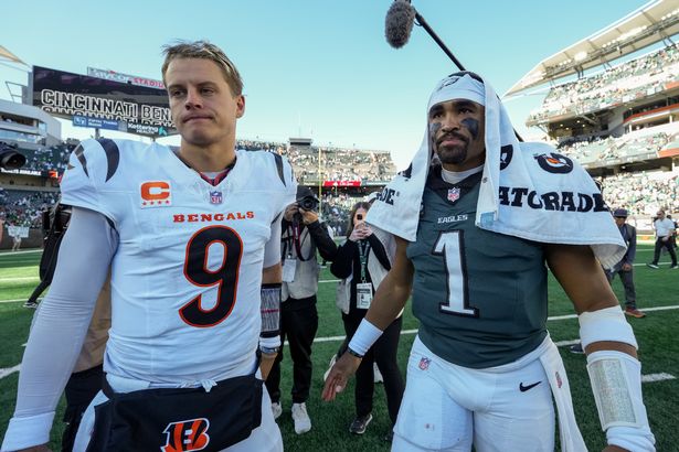 Joe Burrow #9 of the Cincinnati Bengals and Jalen Hurts #1 of the Philadelphia Eagles meet after the Eagles beat the Bengals 37-17 at Paycor Stadium on October 27, 2024 in Cincinnati, Ohio.