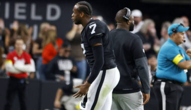 Raiders quarterback Geno Smith (7) argues with coaching staff as he leaves the field during an ...