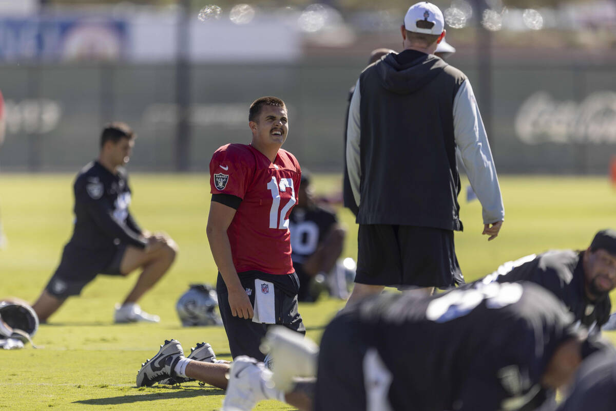 Raiders quarterback Aidan O'Connell (12) stretches during the team’s practice at th ...