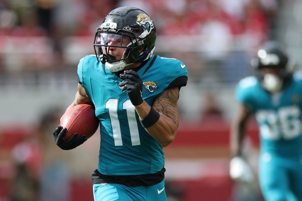 Jacksonville Jaguars player, number 11, running with the football.