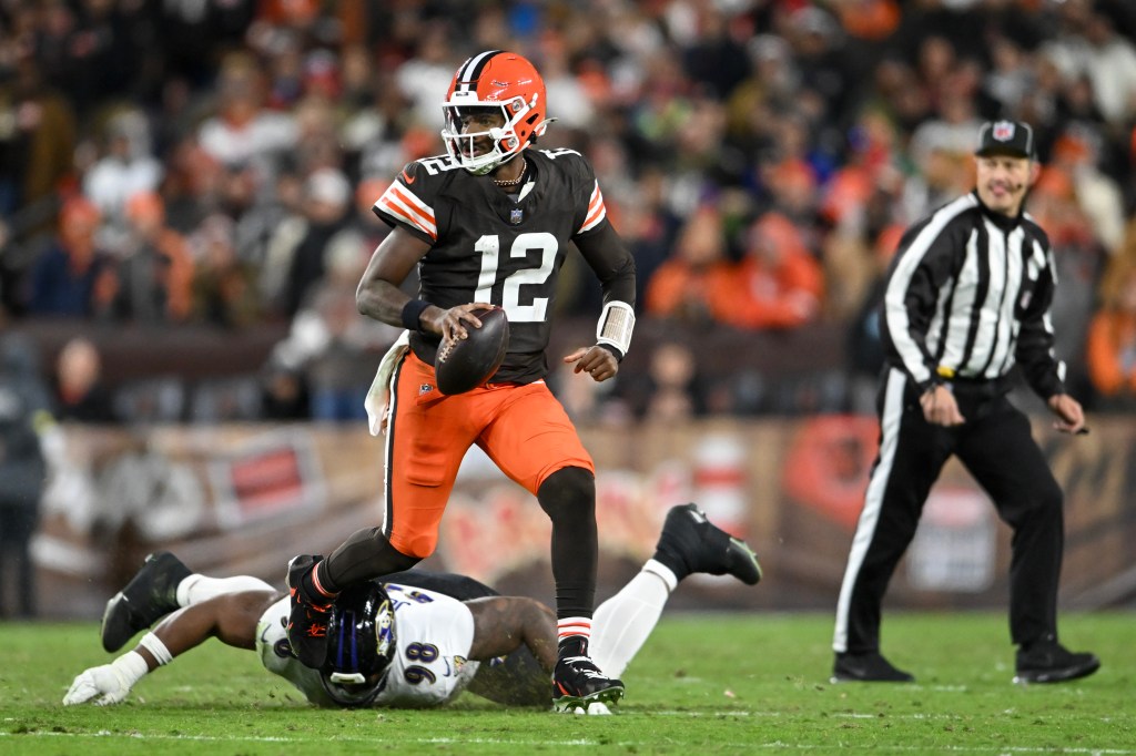 Shedeur Sanders #12 of the Cleveland Browns scrambles with the ball against the Baltimore Ravens during the fourth quarter at Huntington Bank Field on November 16, 2025 in Cleveland, Ohio.