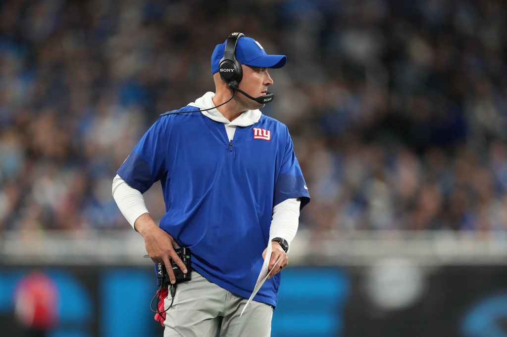 Head coach Mike Kafka of the New York Giants looks on during the first half against the Detroit Lions at Ford Field on November 23, 2025 in Detroit, Michigan.
