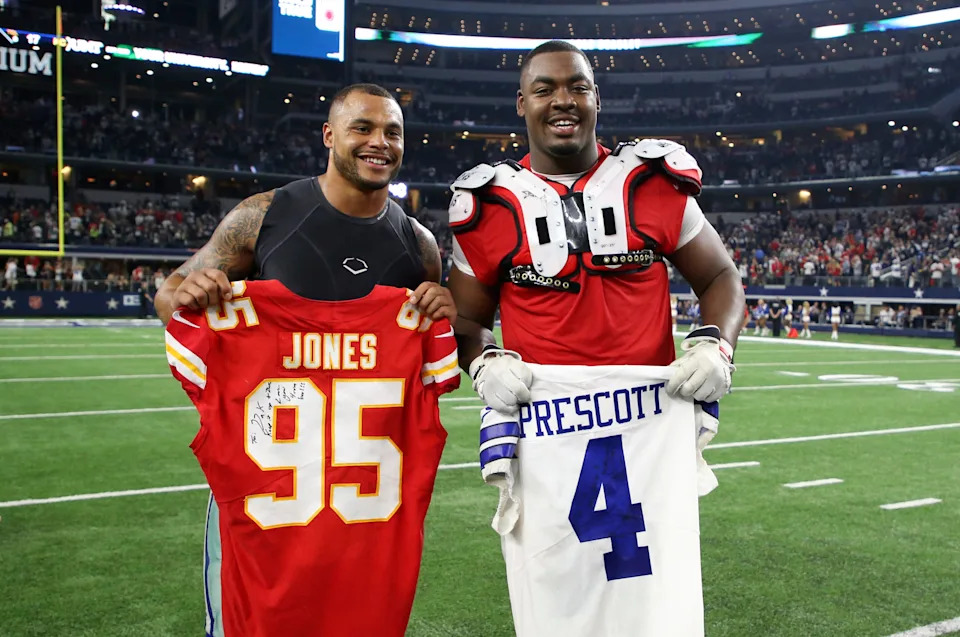 Nov 5, 2017; Arlington, TX, USA; Kansas City Chiefs defensive end Chris Jones (95) and Dallas Cowboys quarterback Dak Prescott (4) exchange jerseys after the game at AT&T Stadium. Mandatory Credit: Kevin Jairaj-USA TODAY Sports