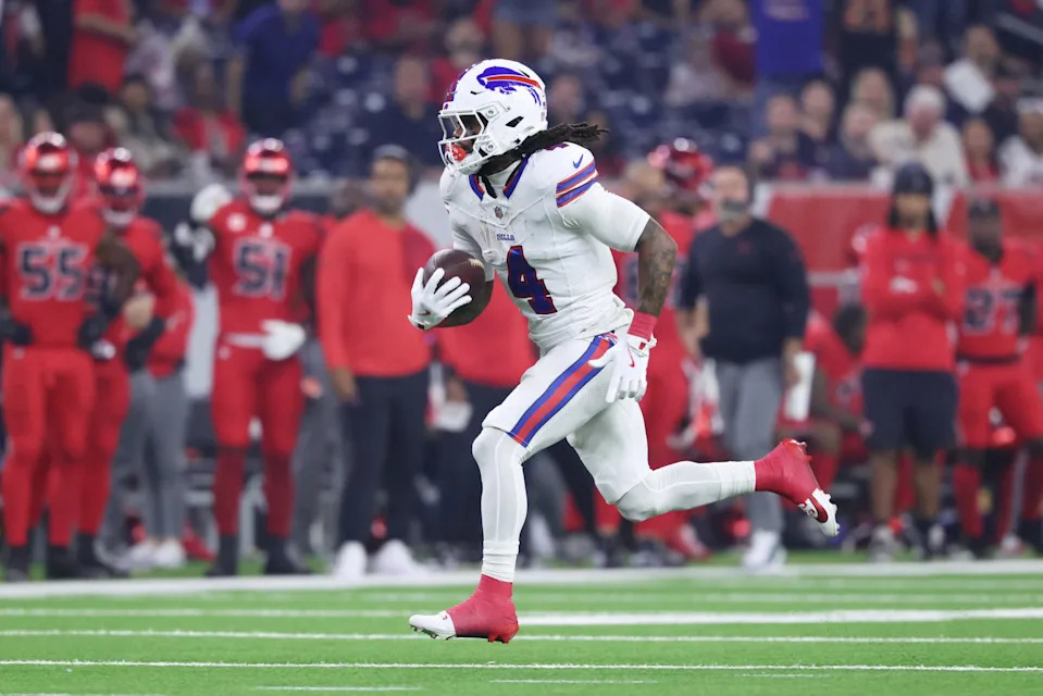 Nov 20, 2025; Houston, Texas, USA; Buffalo Bills running back James Cook III (4) runs for a touchdown against the Houston Texans in the first quarter at NRG Stadium. Mandatory Credit: Troy Taormina-Imagn Images
