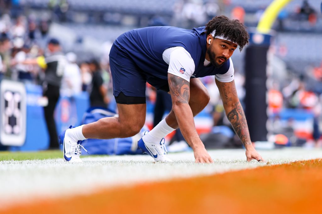 Marshawn Kneeland #94 of the Dallas Cowboys warms up prior to the game against the Denver Broncos at Empower Field at Mile High on October 26, 2025 in Denver, Colorado
