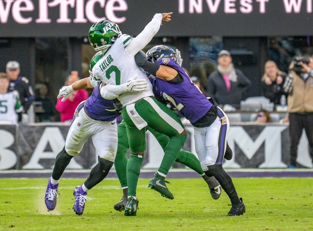 Sunday, Nov. 23, 2025 — New York Jets quarterback Tyrod Taylor (2) is hit as he throws incomplete in the 4th quarter as the Baltimore Ravens host the New York Jets at M&T Bank Stadium.