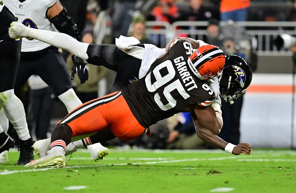 Nov 16, 2025; Cleveland, Ohio, USA; Cleveland Browns defensive end Myles Garrett (95) sacks Baltimore Ravens quarterback Lamar Jackson (8) during the second quarter at Huntington Bank Field. Mandatory Credit: Ken Blaze-Imagn Images