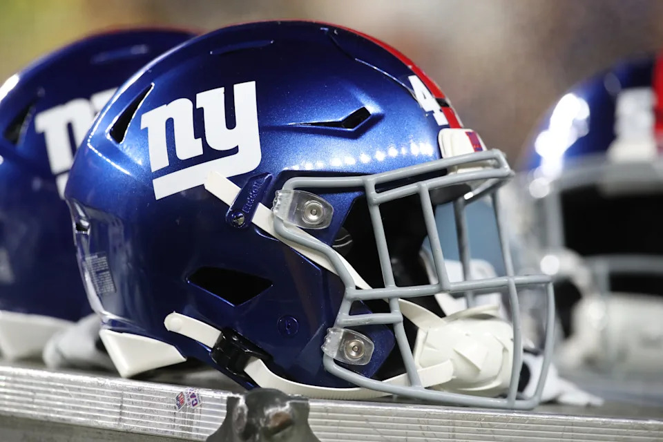 New York Giants helmets on the sidelines against the Pittsburgh Steelers.